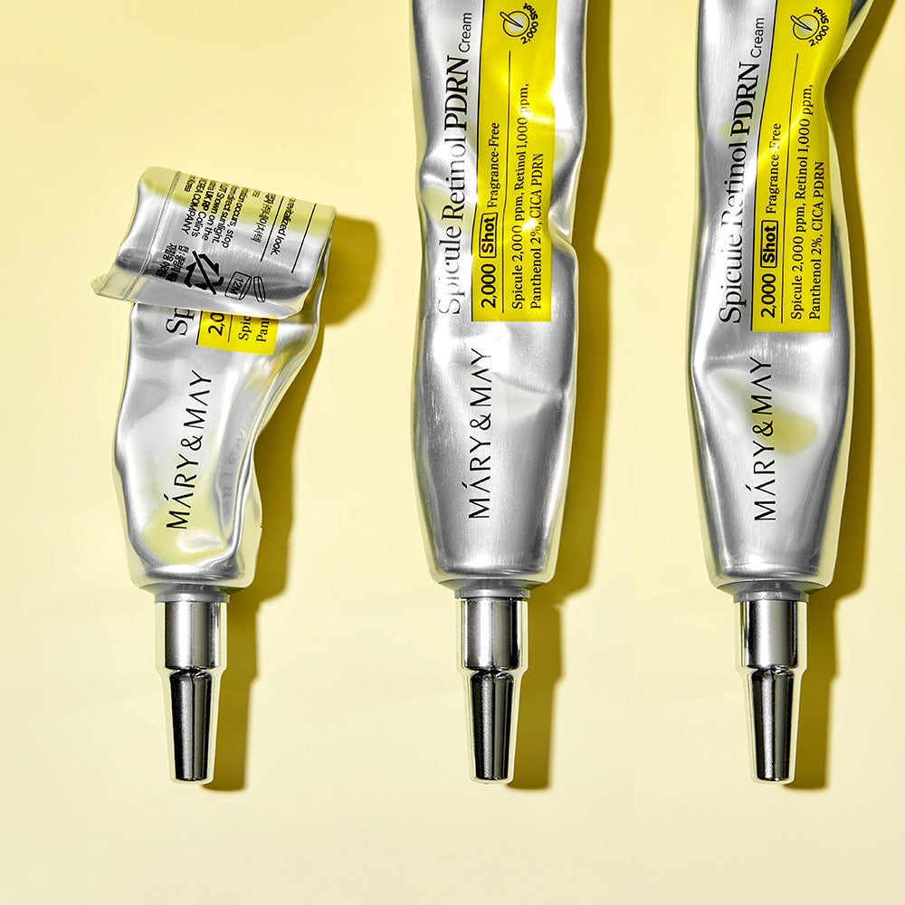 MARY&MAY  Speculum Retinol PDRN Cream 15g, tubes crème sur fond jaune, vue produit en contexte cosmétique