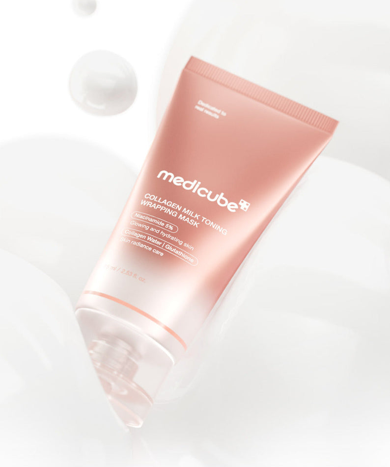 MEDICUBE Collagen Milk Wrapping Mask 80ml de la marque MEDICUBE, tube rose posé sur fond blanc lumineux.
