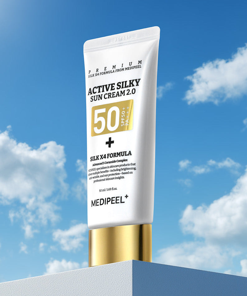 MEDIPEEL Active Silky Sun Cream 2.0 50ml : tube crème solaire SPF50 sur ciel bleu et nuages, packaging premium.