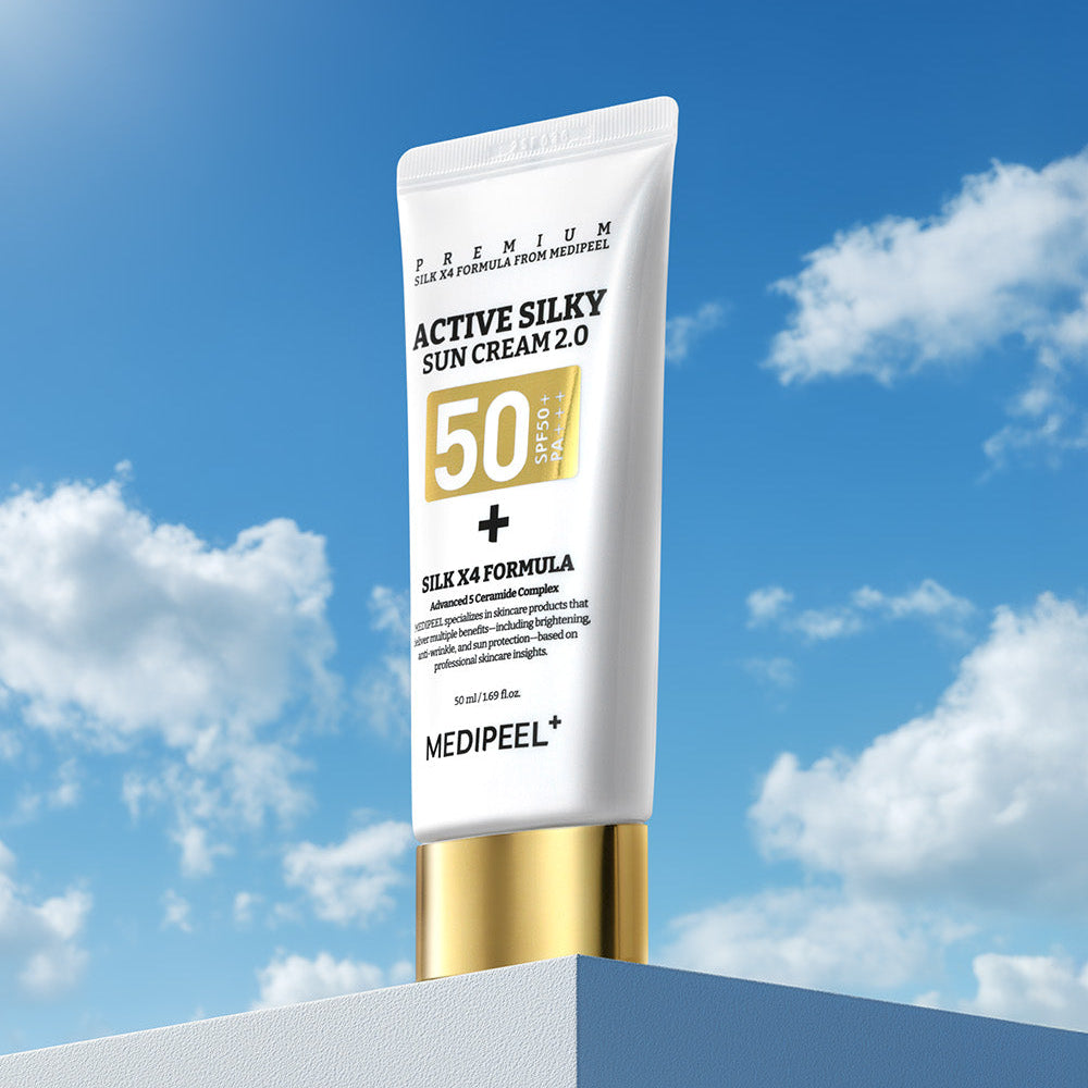 MEDIPEEL Active Silky Sun Cream 2.0 50ml : tube crème solaire SPF50 sur ciel bleu et nuages, packaging premium.