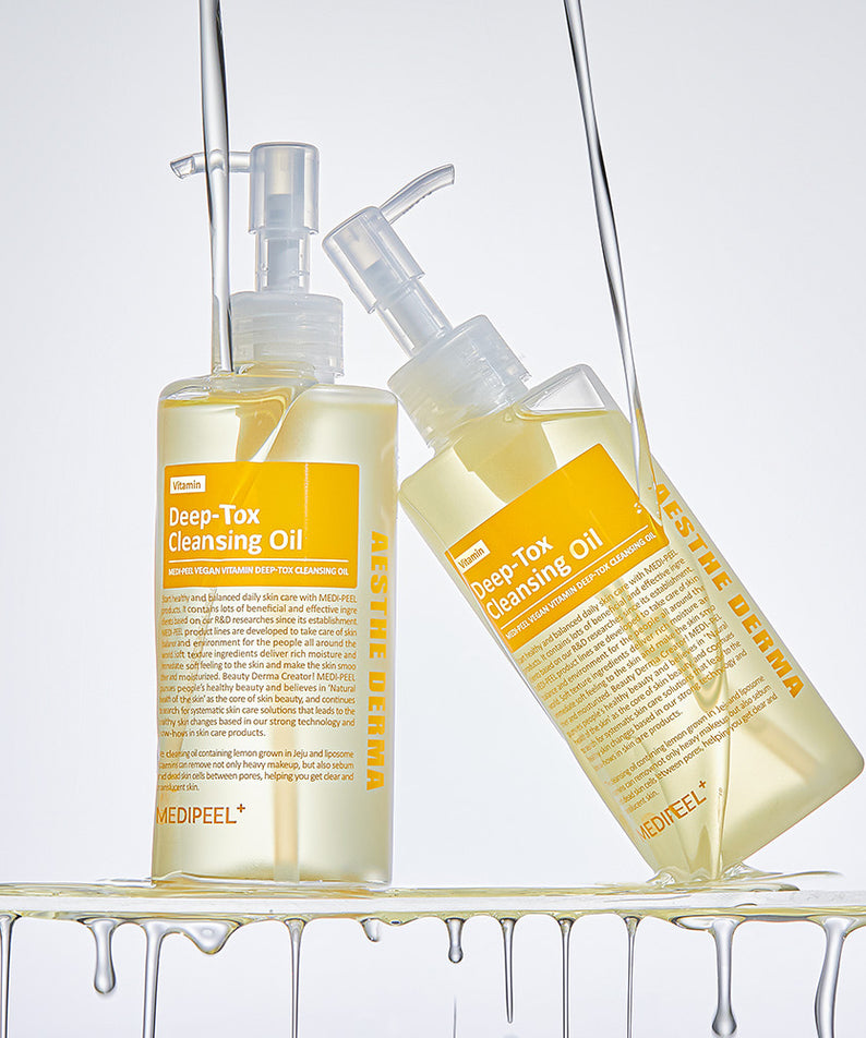 Flacons de MEDIPEEL Vegan Vitamin Deep Tox Cleansing Oil 200ml sur fond blanc.