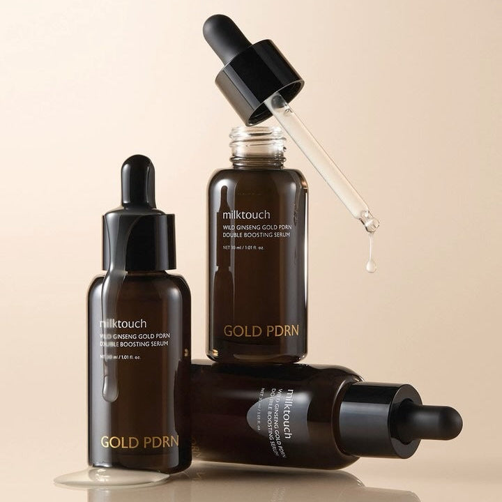 MILK TOUCH Ginseng Gold PDRN Double Boosting Serum 30ml, marque Milk Touch, flacons et pipette sur fond beige