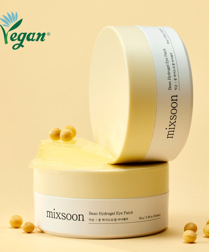 Emballage de MIXSOON Bean Hydrogel Eye Patch 60 Sheets, produit hydratant pour les yeux à base de haricots, étiqueté vegan et présenté sur fond beige.