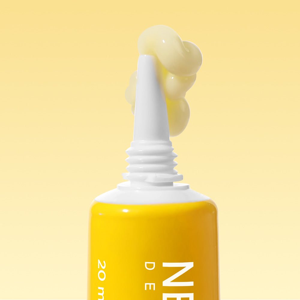 NEOGEN  Next Clear Eye Cream 20ml, flacon jaune sur fond jaune, goutte/embout applicateur, photo produit en gros plan.