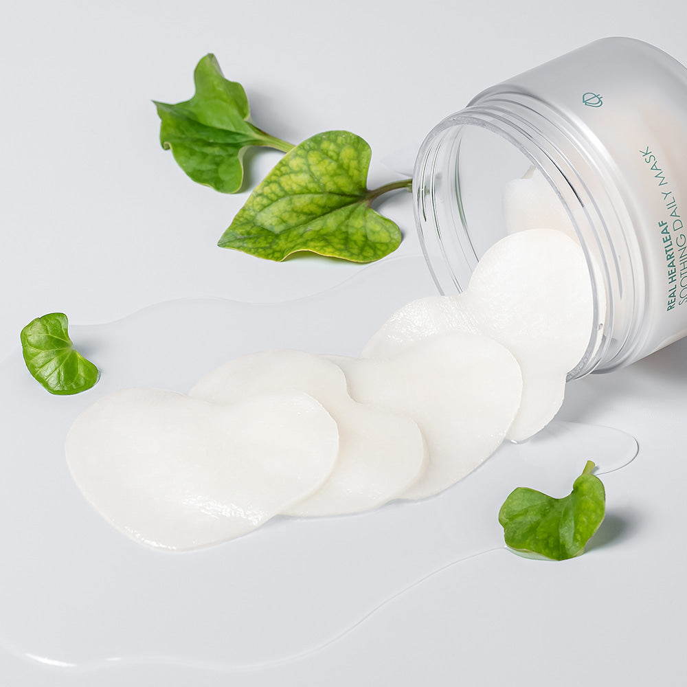 NEOGEN Real Heartleaf Soothing Daily Mask 40 Sheets — masque crème sur pot, feuilles de cœur vert, ambiance soin visage