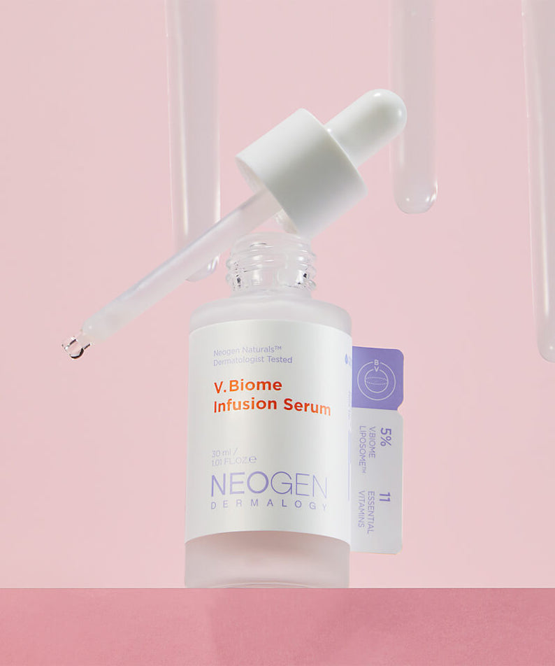 Sérum NEOGEN V Biome Infusion 30ml, soin de la peau avec compte-gouttes sur fond rose, cosmétique innovant pour revitaliser la peau.