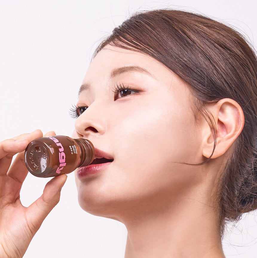 Décris l'image en français en mentionnant le produit : NOTHING BETTER Tangly Glow Shot 7 Bottles, boisson glow