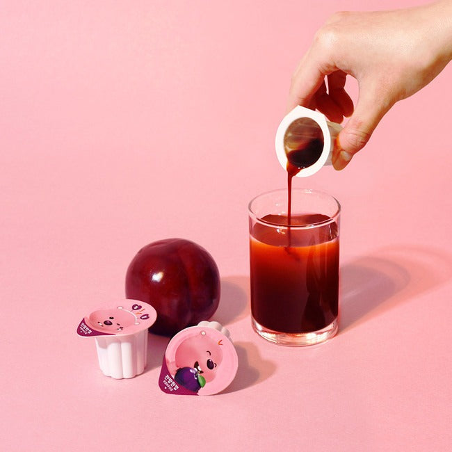 Décris l'image en français : NOTHING BETTER Zanmang Loopy Cup Purun & Lactobacillus 14p versé sur fond rose.