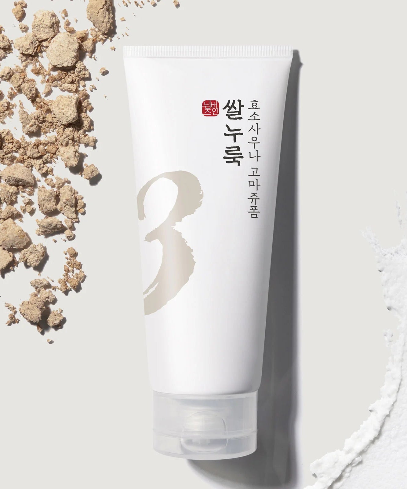 NUMBUZIN No.3 Rice Yeast Enzyme Suana Gommage Foam 170ml : tube sur fond clair avec éléments de riz et mousse