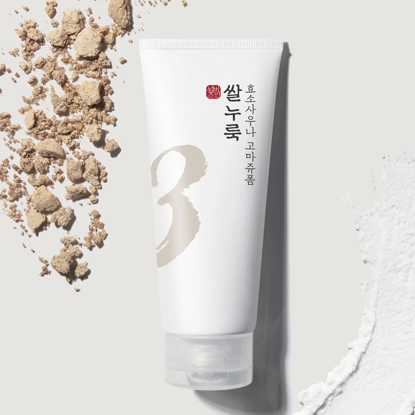 NUMBUZIN No.3 Rice Yeast Enzyme Suana Gommage Foam 170ml : tube sur fond clair avec éléments de riz et mousse