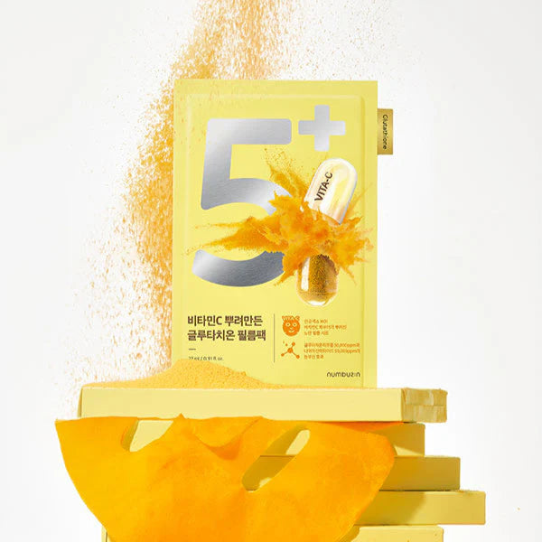 NUMBUZIN No.5 Vitamin Spotlight Sheets Mask, masque en feuille, emballage jaune sur fond lumineux avec gouttes de vitamine.