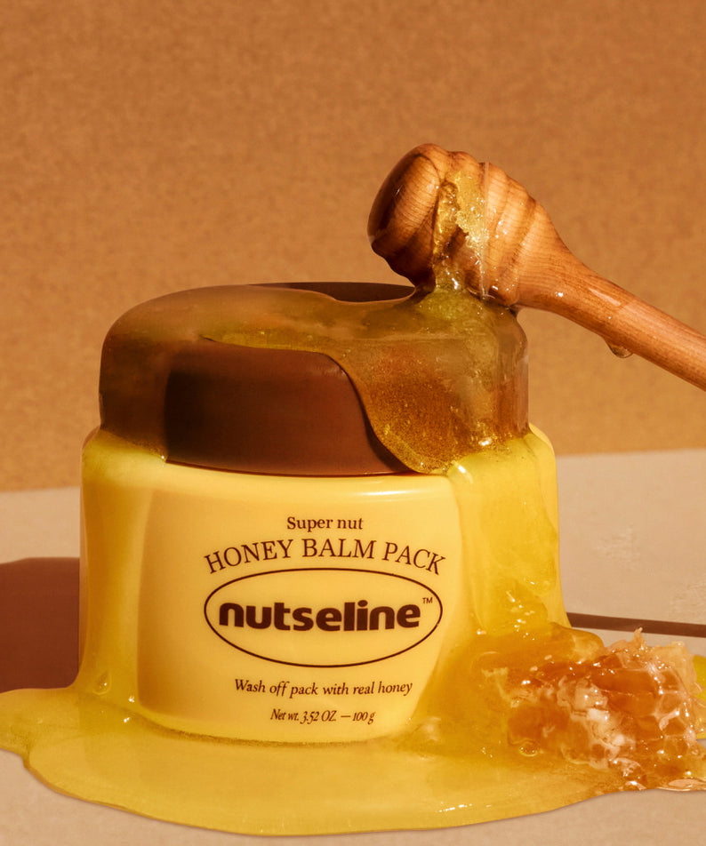 Pot de NUTSELINE Super Nut Honey Balm Pack 100g avec miel coulant et cuillère en bois.