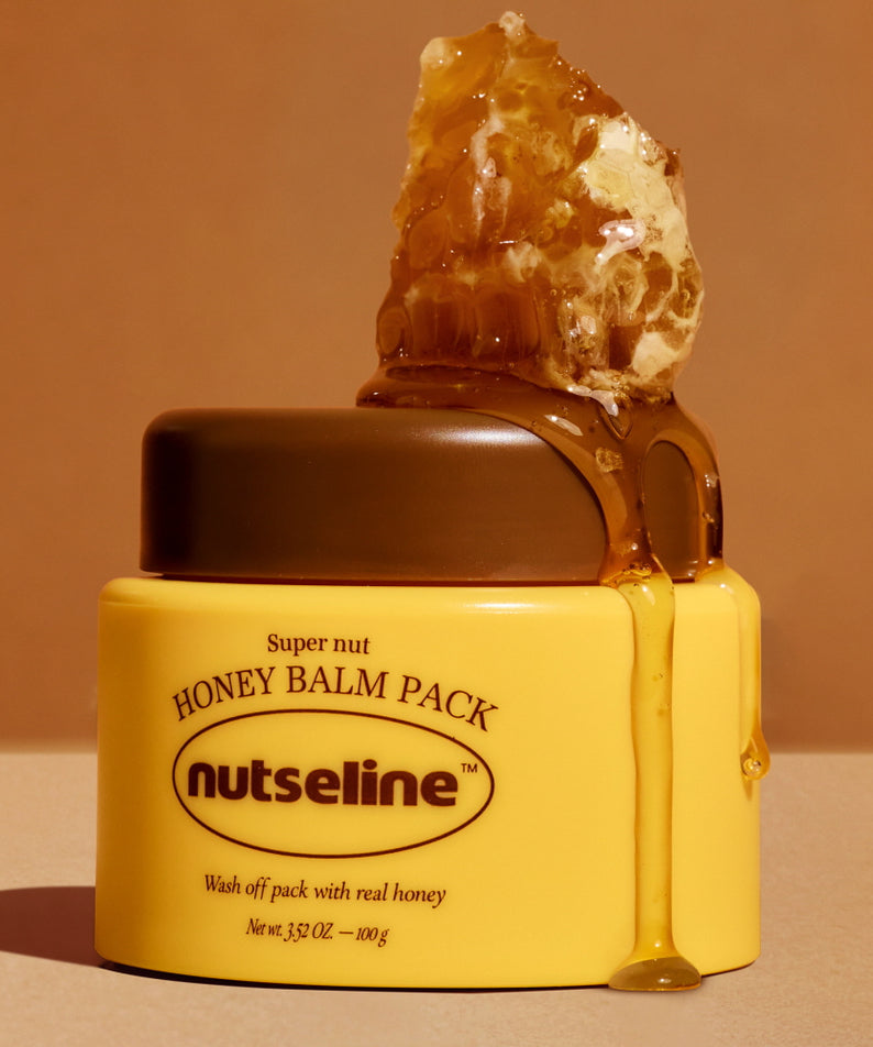 NUTSELINE Super Nut Honey Balm Pack 100g avec miel véritable, pot jaune sur fond beige, soin pour la peau nourrissant et hydratant.
