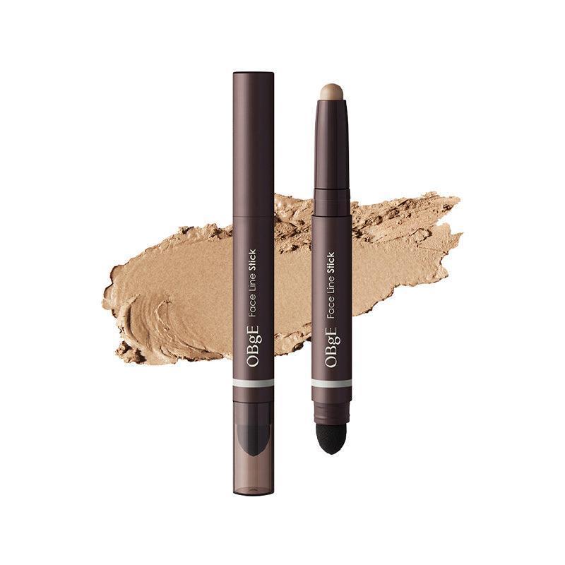 OBGE Face Line Stick de la marque OBGE sur texture maquillage beige, fond blanc, photo produit