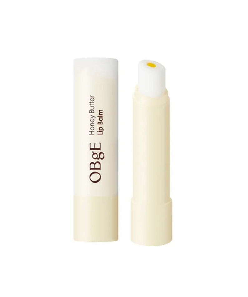 OBGE Honey Butter Lip Balm de la marque OBGE, stick baume à lèvres à la texture miel-beurre sur fond blanc