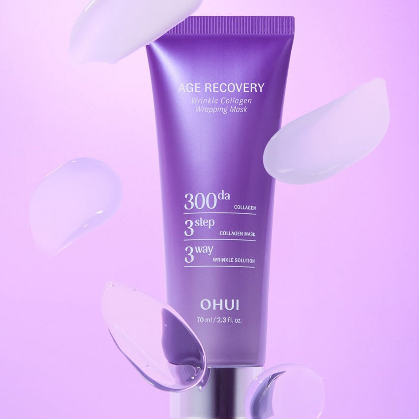 OHUI Age Recovery Collagen Wrapping Mask 70ml : tube violet sur fond rose, application de masque cosmétique anti-âge.