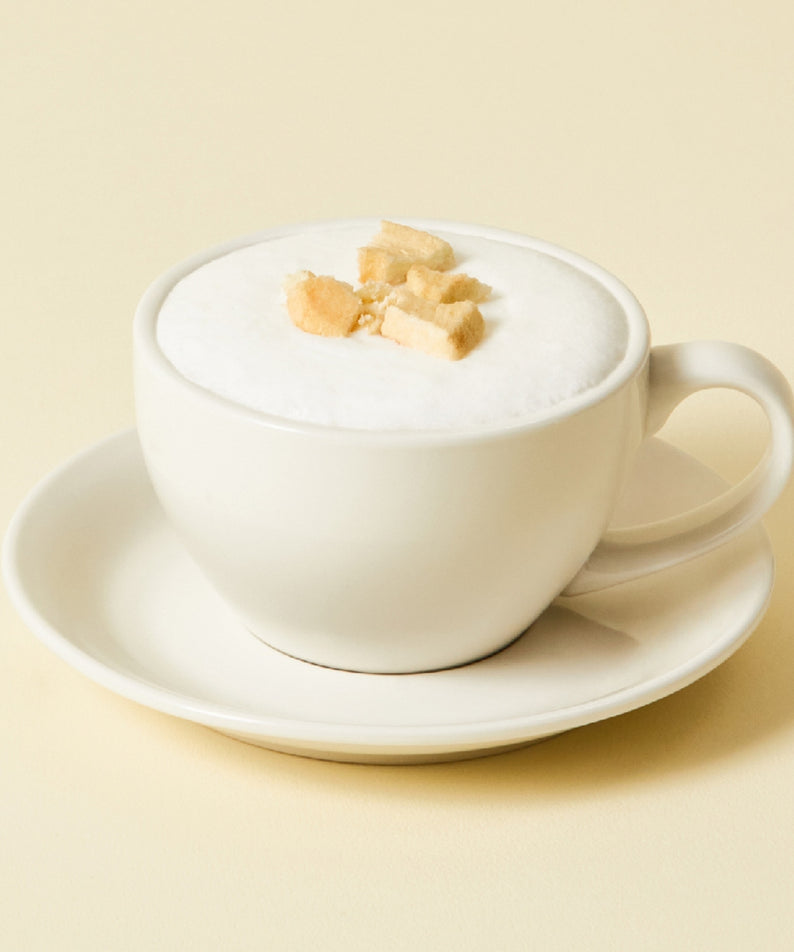 OSULLOC Chamomile Blend 10 p : tasse crème avec fleurs de camomille, marque OSULLOC, fond beige, ambiance zen.