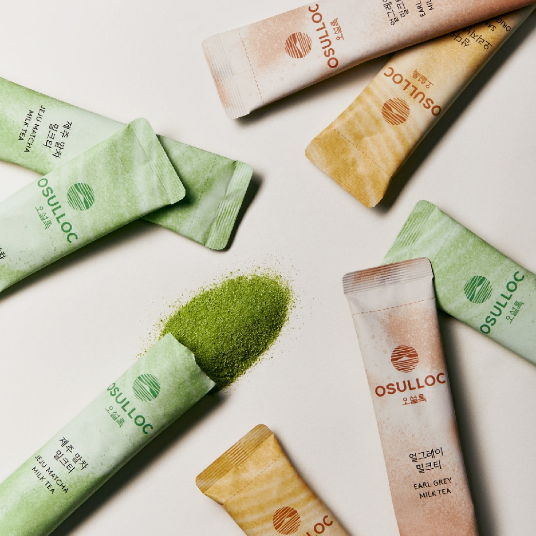 OSULLOC Earl Grey Milk Tea 10 p, marque Osulloc, sachets colorés sur fond clair avec thé Earl Grey en poudre.