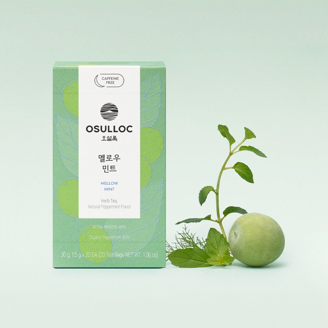 OSULLOC [Organic, Caffeine-Free] Mellow Mint de la marque OSULLOC, boîte verte et feuilles de menthe sur fond clair