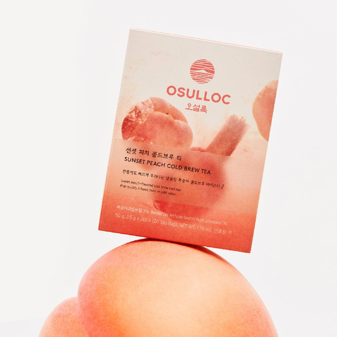 OSULLOC Sunset Peach Cold Brew Tea 20 P : sachet rose pêche sur fond clair, marque OSULLOC, ambiance coucher de soleil.