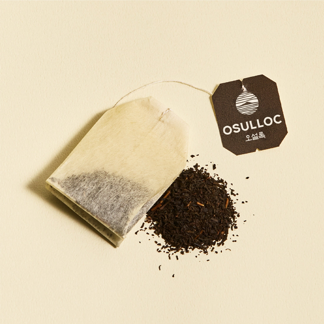 OSULLOC Yuja Earl Grey 20 p, sachet en filtre et feuilles de thé sur fond clair, marque OSULLOC