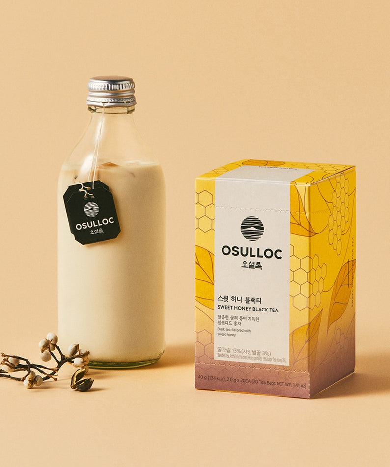 OSULLOC Sweet Honey Black Tea 20 P avec une box élégante et une boisson crémeuse sur fond beige.