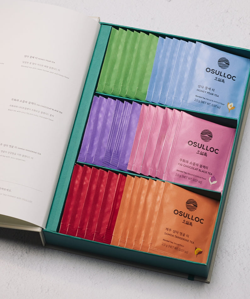 Boîte ouverte de sachets de thé OSULLOC Tea Variation O 6 types, couleurs variées, présentation élégante. Idéal pour les amateurs de thé.