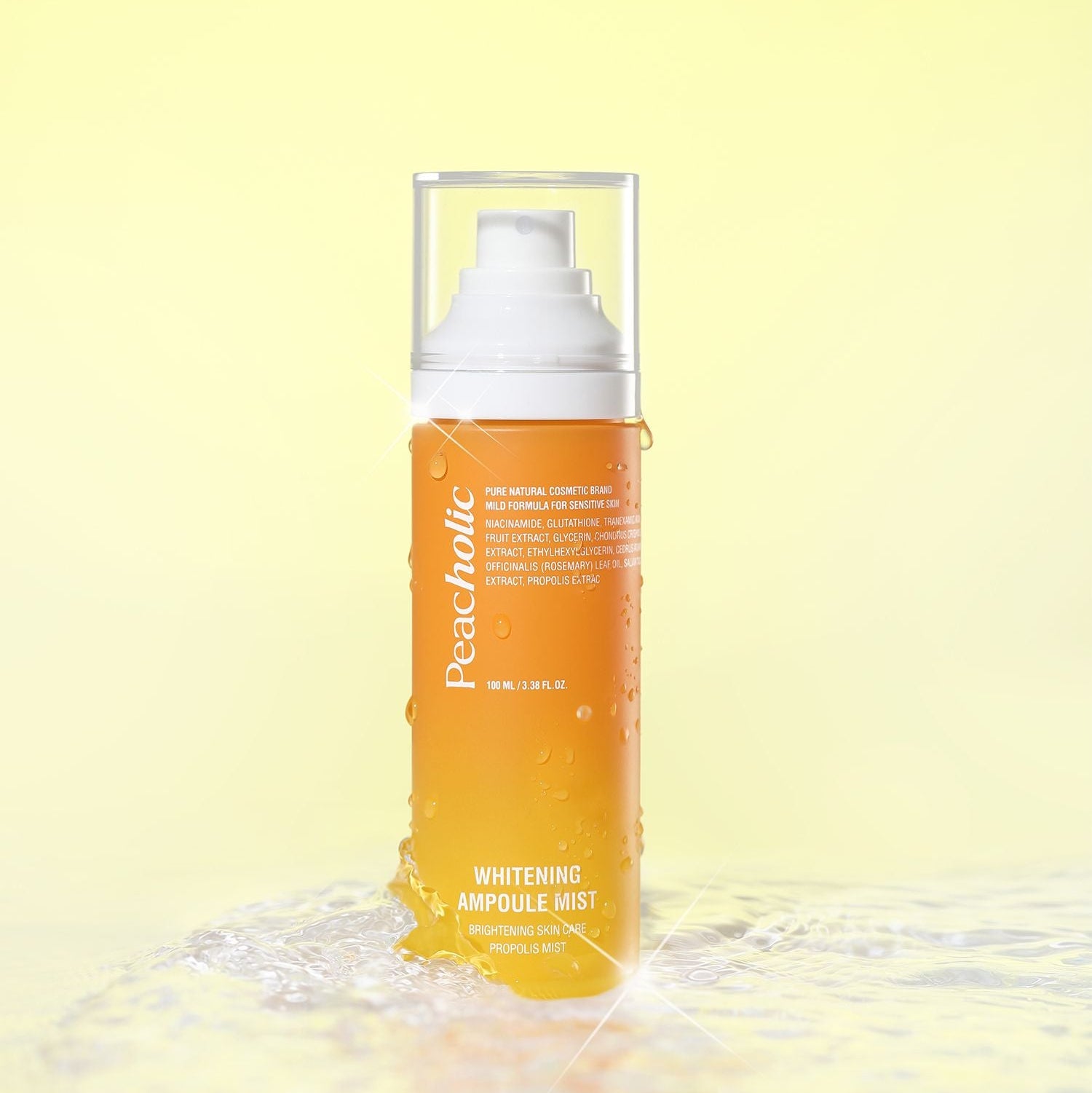 PEACHOLIC  Whitening Ampoule Mist 100ml, flacon brume blanche et gel orange sur fond jaune, visuel beauté.