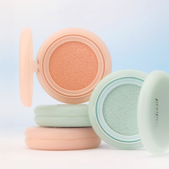 PERIPERA Filter Fit Milk Tone-Up Cushion : coussin au rendu beige et vert, boîtes pastel sur fond bleu clair, marque PERIPERA.