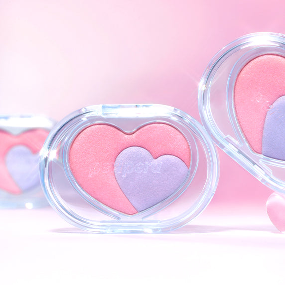 PERIPERA Heart Pocket Beam, mini palettes cœur roses et violettes, gros plan sur fond rose pastel.