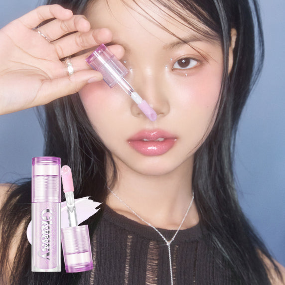 PERIPERA Ink Glazing Lip Gloss Plumper de PERIPERA, présentée en gros plan sur lèvres, flacon violet, maquillage beauté.