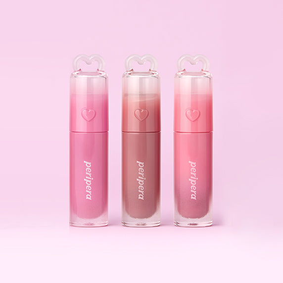 PERIPERA Ink Mood Glowy Tint en flacons roses et pêche, fond rose pastel, vue produit en studio