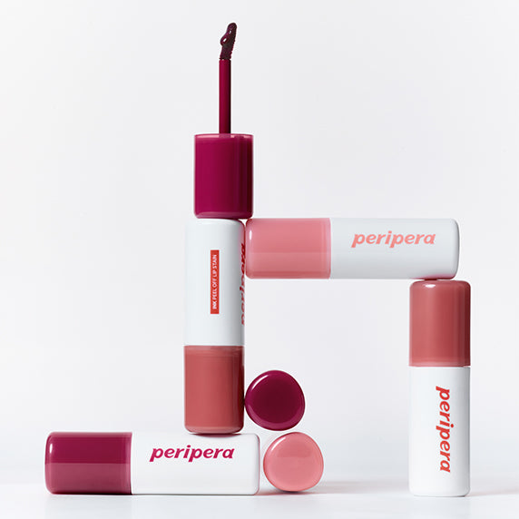 PERIPERA Ink Peel-Off Lip Stain de la marque Peripera, présentée en tubes et teintes sur fond blanc.