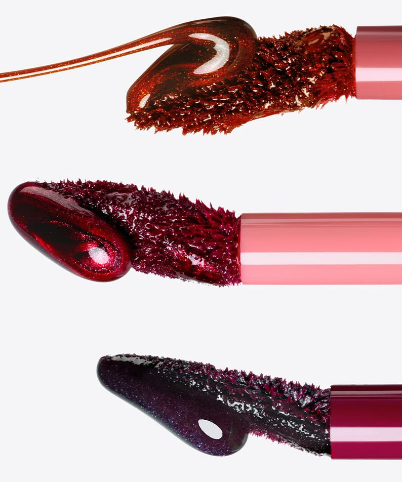 PERIPERA Ink Peel-Off Lip Stain, gros plan sur l’embout et la texture en teinte bordeaux, sur fond blanc.