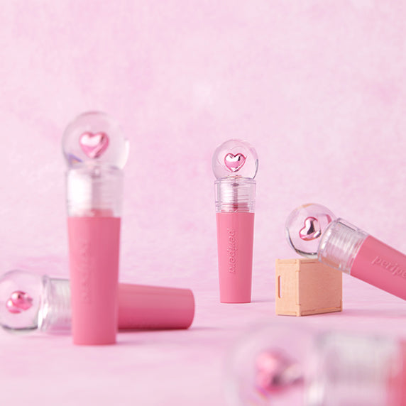 PERIPERA Ink The Gellable Tint, packshots cosmétiques roses sur fond pastel, marque PERIPERA, contexte visuel maquillage