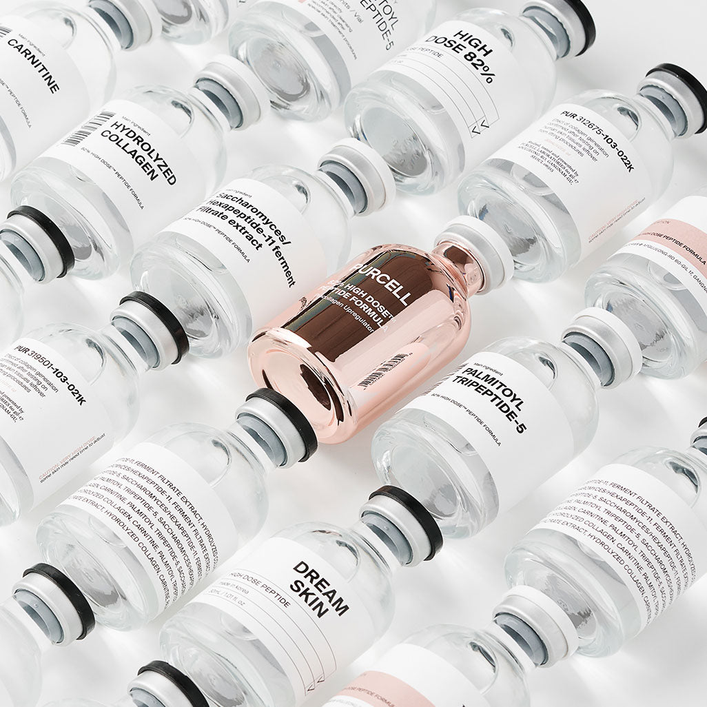 PURCELL 82% High Dose™ Peptide Formula 30mL, flacons blancs et cuivrés de la marque PURCELL, image studio.