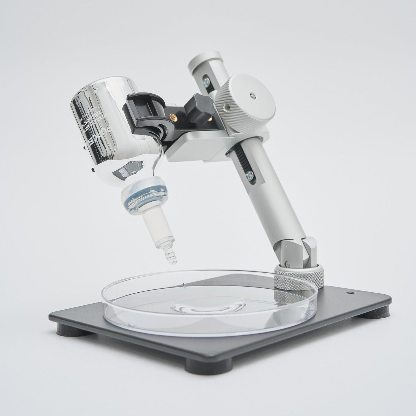 PURCELL Pixcell Biom PixelBiome™ 2 billion/mL 30ml, flacon de marque PURCELL sur support, microscope en arrière-plan.