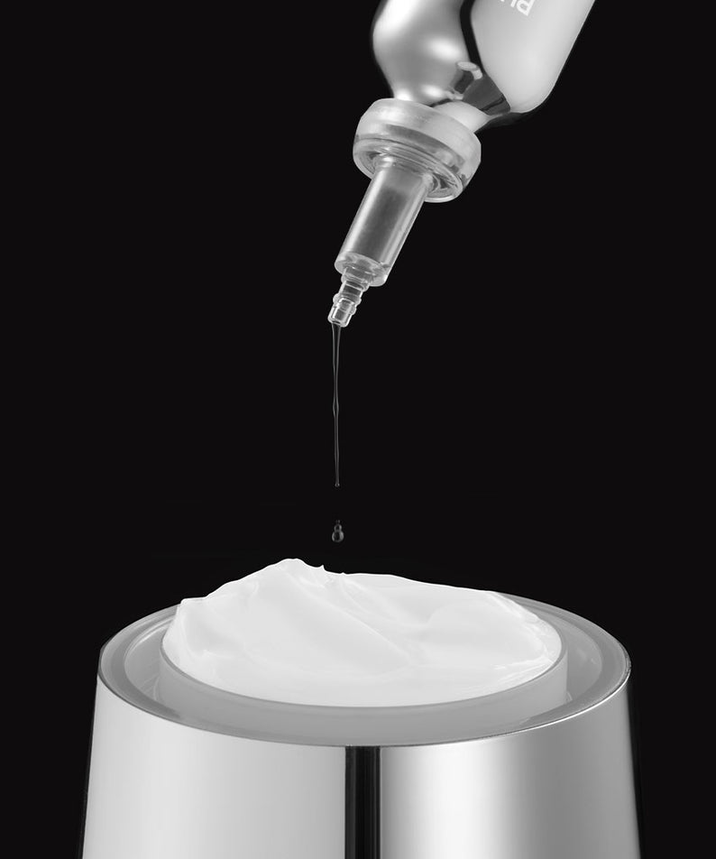 PURCELL PixelBiome™ Set (30mL of concentrate + 50mL of cream) : concentré et crème en flacon-pompe, style soin beauté sur fond noir