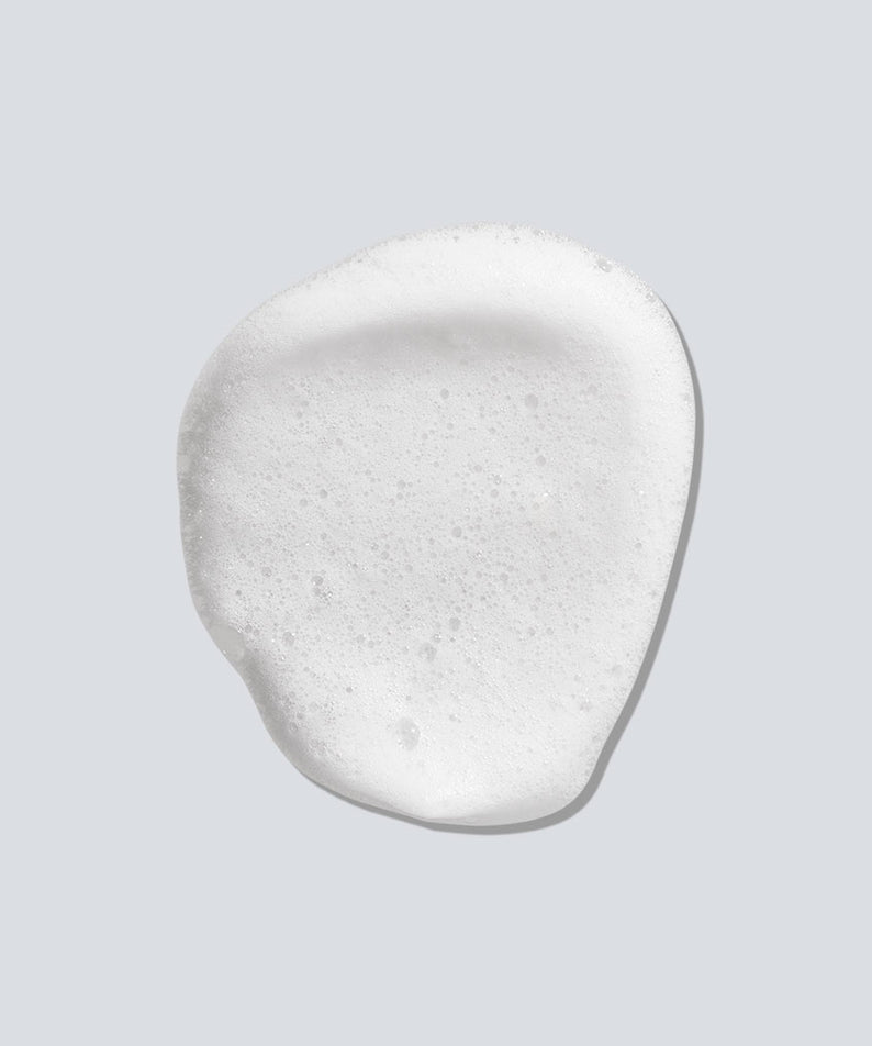 Décris l'image en français : PURCELL Pixelform Scalp Barrier Shampoo 280ml de PURCELL, crème mousse blanche sur fond clair.