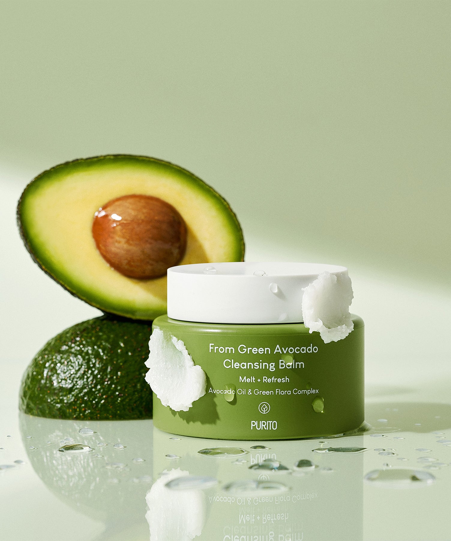 PURITO From Green Avocado Cleansing Balm 100ml, pot vert et avocats, décor visuel beauté sur fond clair, contexte skincare.