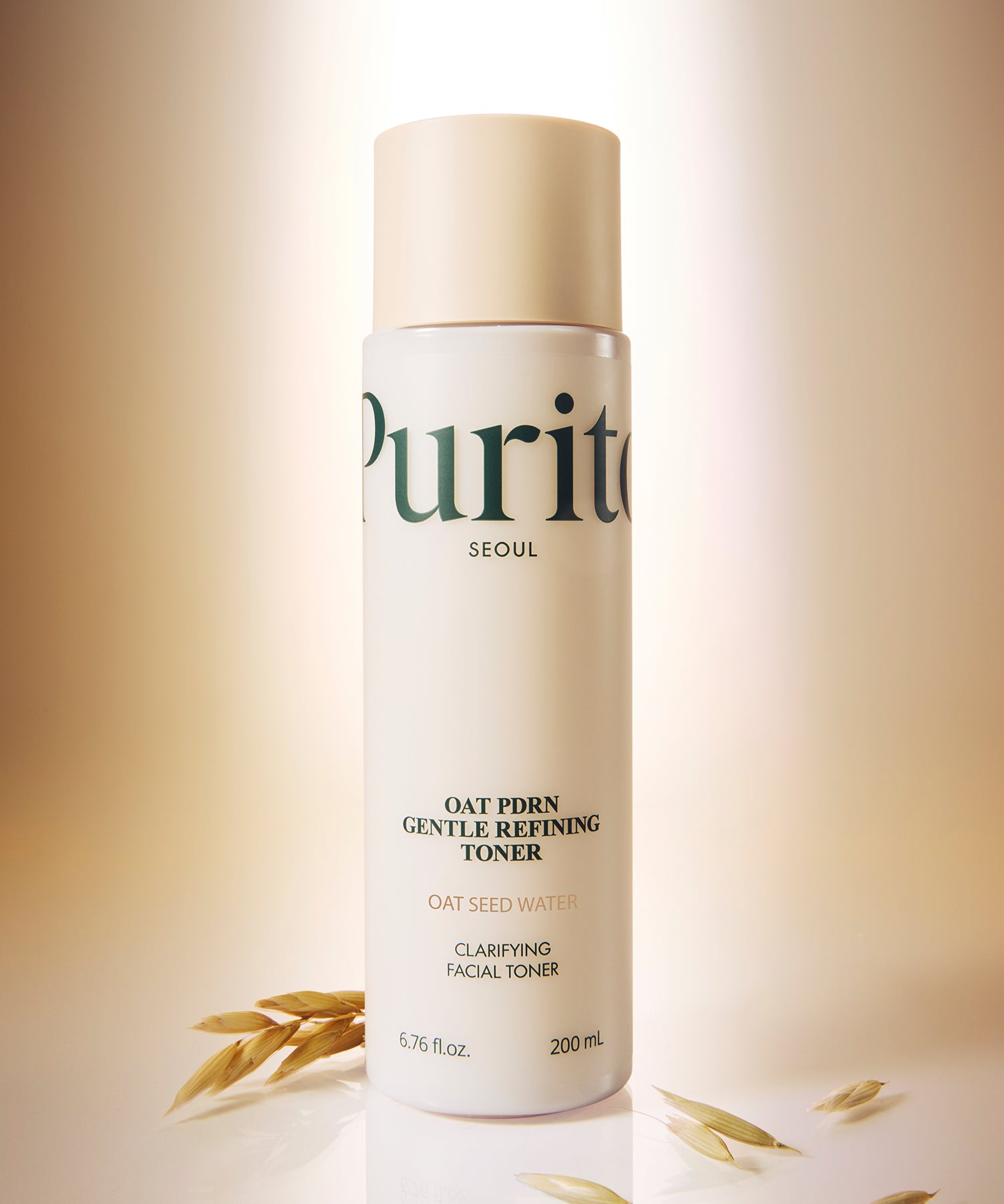 PURITO Oat PDRN Gentle Refining Toner 200ml, bouteille PURITO Seoul sur fond beige avec grains d’avoine