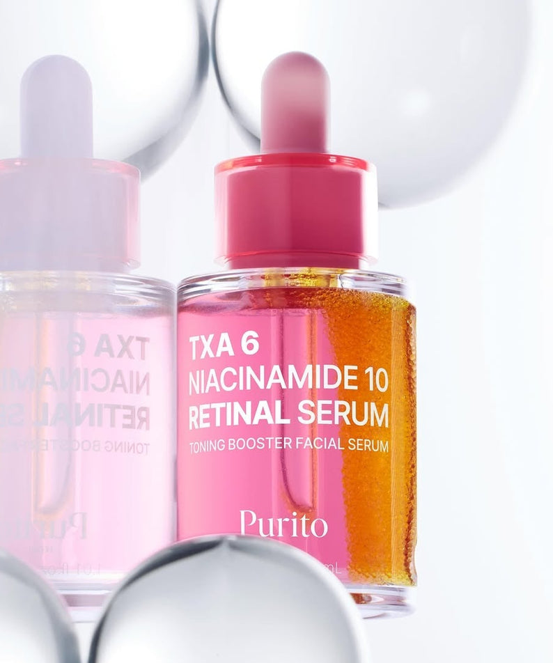 Décris l'image en français : PURITO Tranexamic Acid 6 Niacinamide 10 Retinal Serum 30ml, flacons rosés, sur fond blanc.