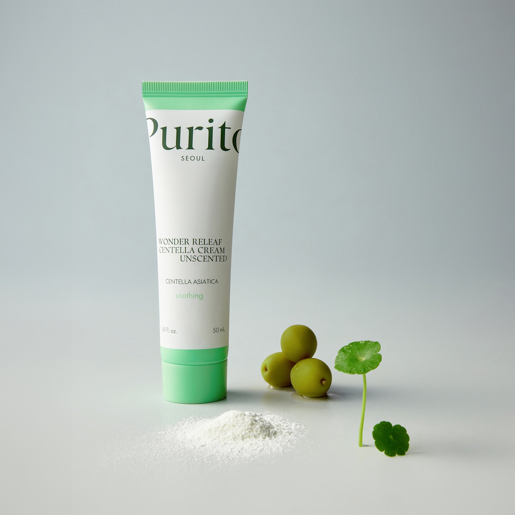 PURITO Wonder Releaf Centella Cream Unscented 50ml, tube crème vert PURITO sur fond clair avec herbes et olives