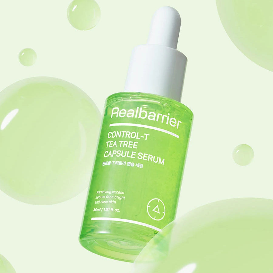 REAL BARRIER Control-T Tea Tree Capsule Serum 30ml de Real Barrier, sur fond vert avec bulles et gouttes