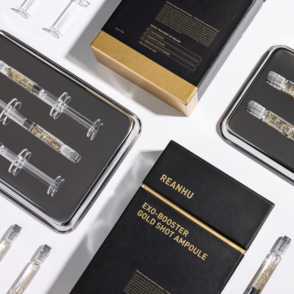 REANHU Exo Booster Gold Shot Ampoule 2 g X 7 ea, marque REANHU, flacons dorés sur fond blanc, vue packshot.