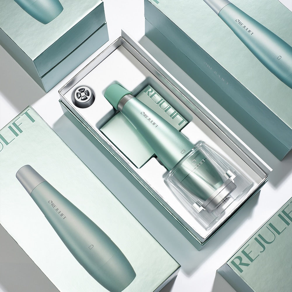 REJURAN Premium Beauty Device, coffret et appareil beauté gris-vert sur fond clair, présentation produit de la marque