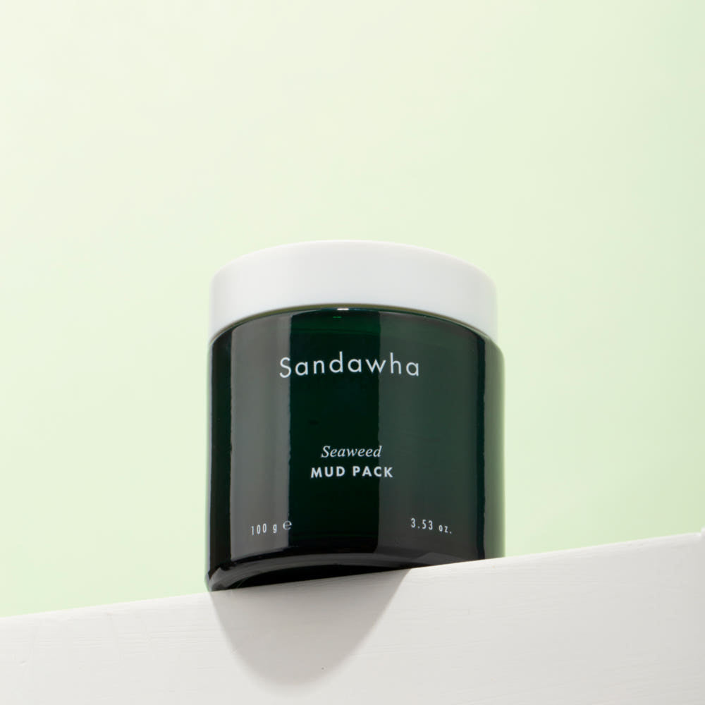 SANDAWHA Seaweed Mud Pack 100g : pot de masque à la boue à l’algue, marque SANDAWHA, sur fond vert clair.