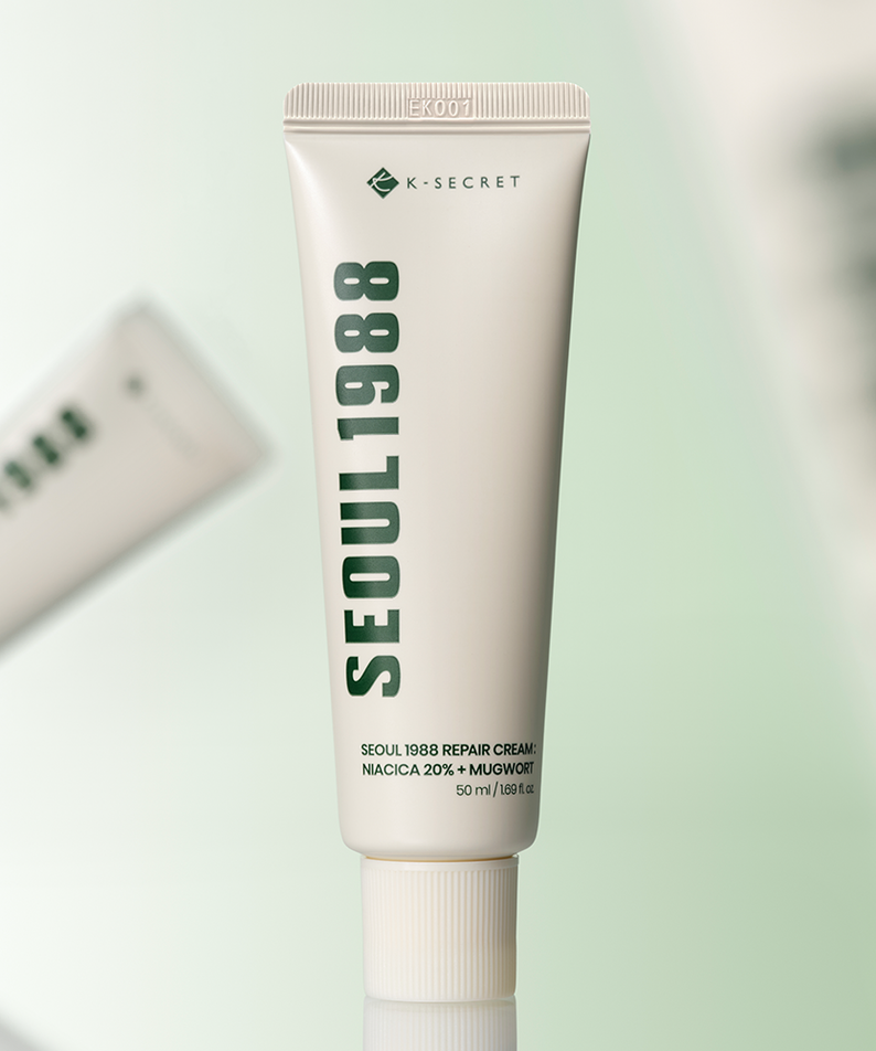 SEOUL 1988  Niacica Repair Cream 50ml : tube crème K-SECRET sur fond clair, vue produit en studio.