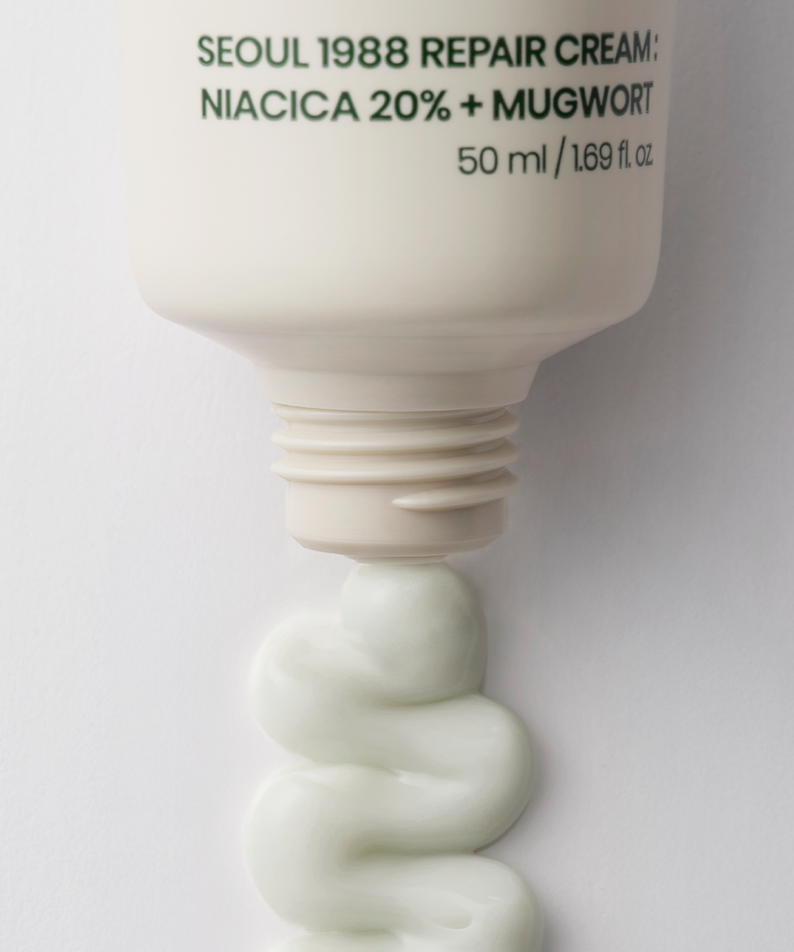 SEOUL 1988  Niacica Repair Cream 50ml, crème réparatrice visible sur tube blanc, contexte studio fond clair.