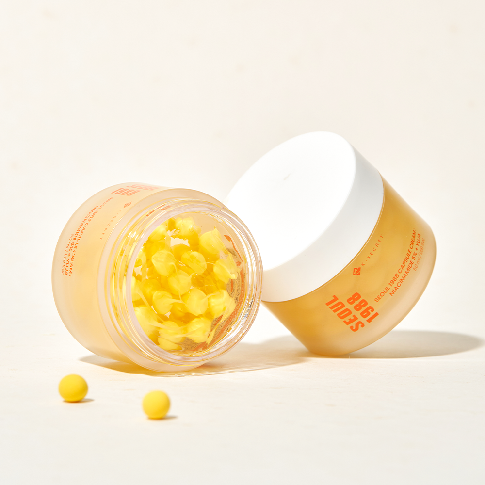 SEOUL 1988  Niacin Yuja Capsule Cream 50ml : crème en capsule ouverte, marque sur le flacon, fond clair.